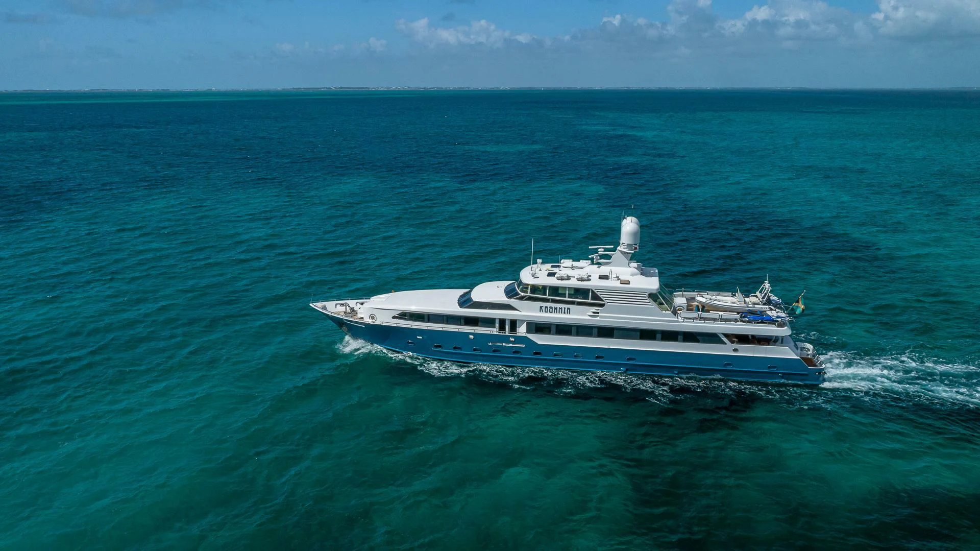 a large white boat in the water aboard KASHMIR Yacht for Charter
