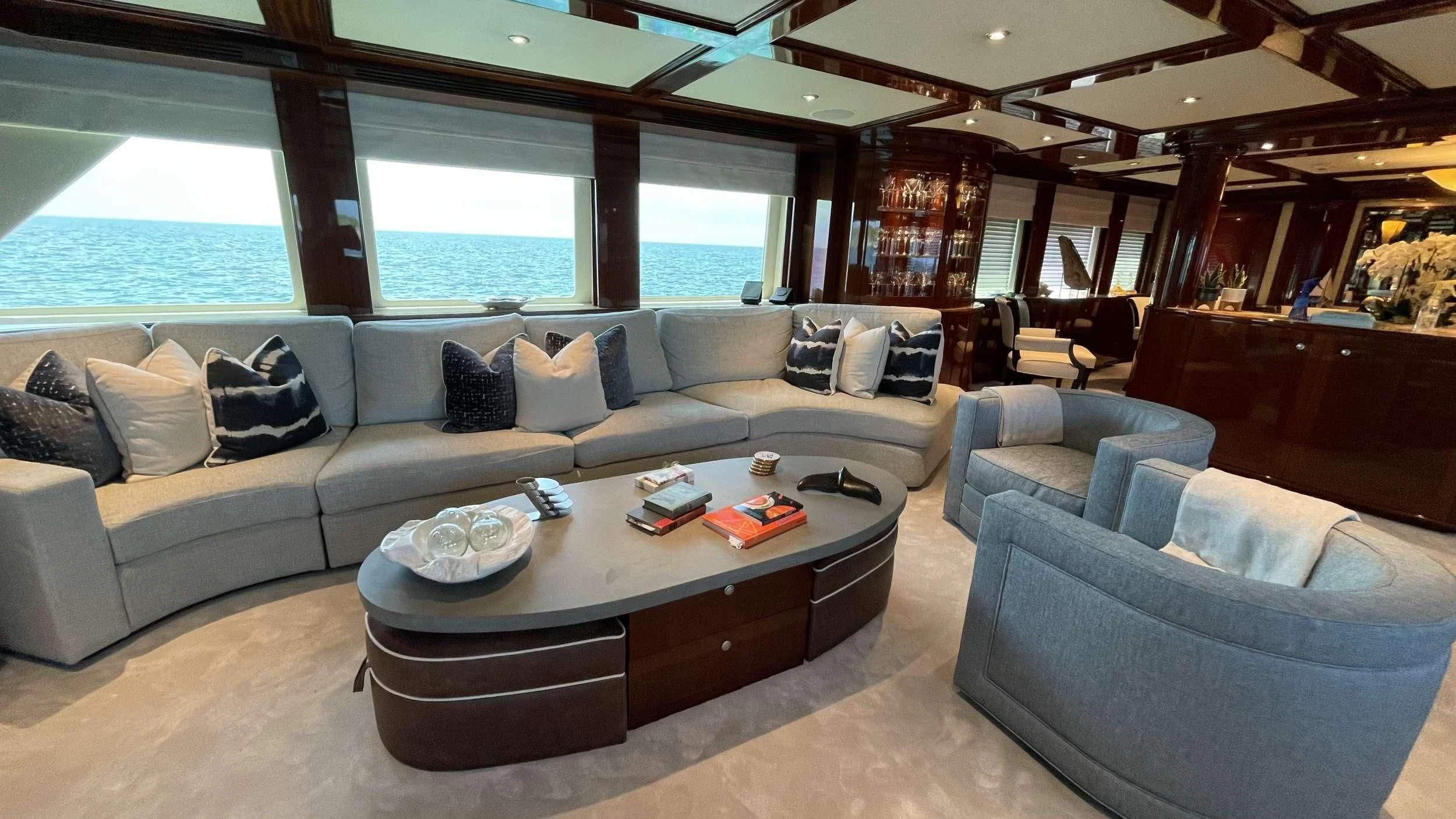 a living room with a large window aboard KASHMIR Yacht for Charter
