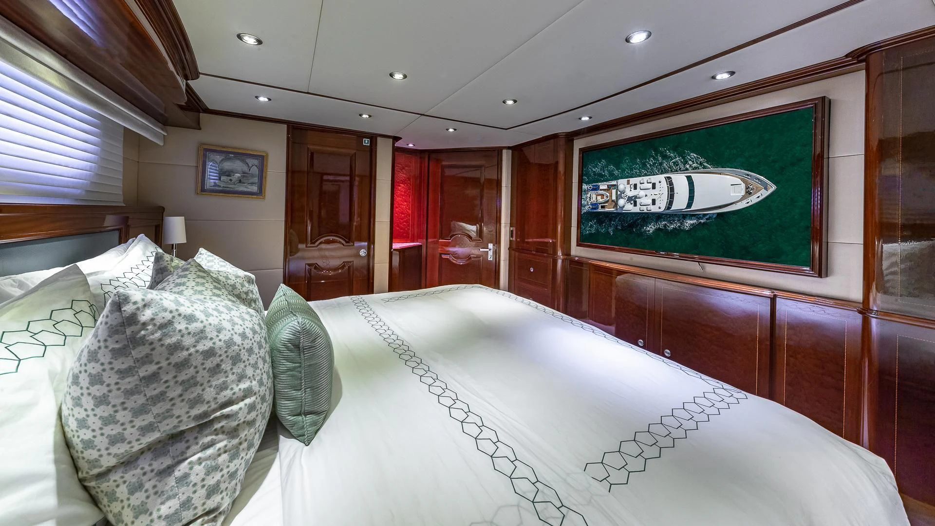 a bed with pillows and pillows aboard KASHMIR Yacht for Charter