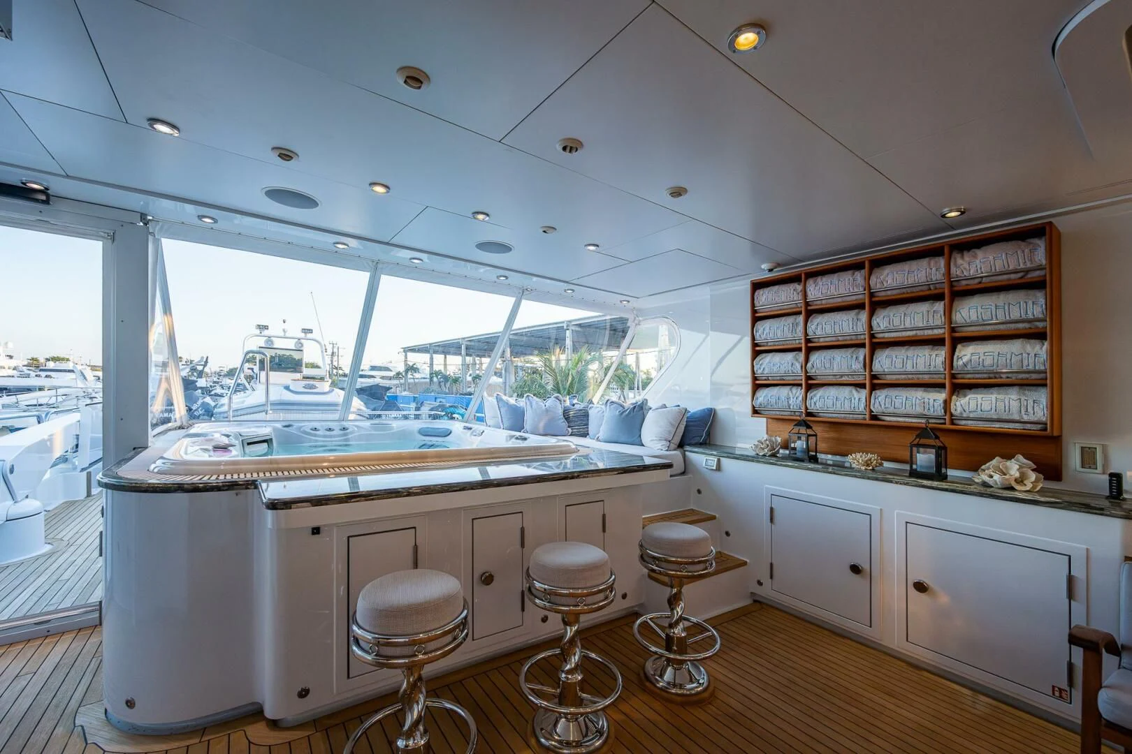 a kitchen with stools and a bar in the background aboard KASHMIR Yacht for Charter