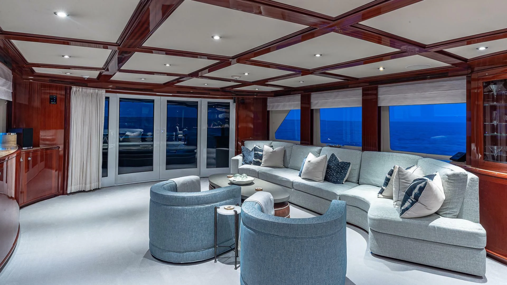 a living room with a large window aboard KASHMIR Yacht for Charter