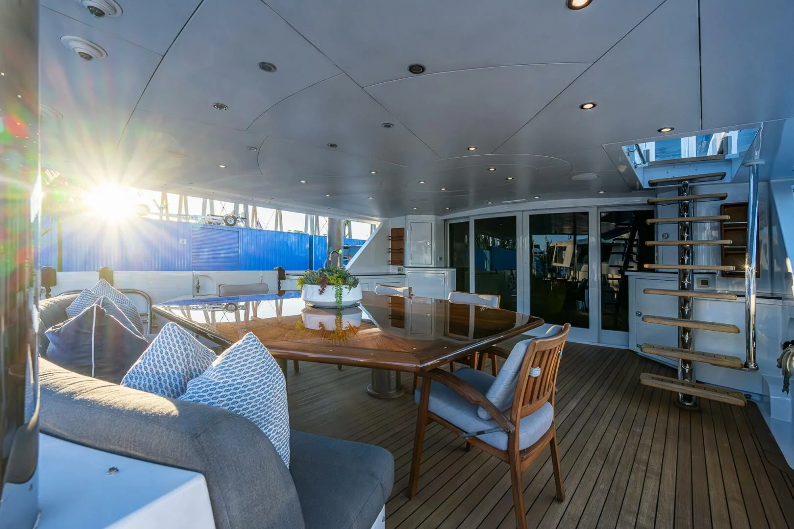 a room with a table chairs and a window aboard KASHMIR Yacht for Charter