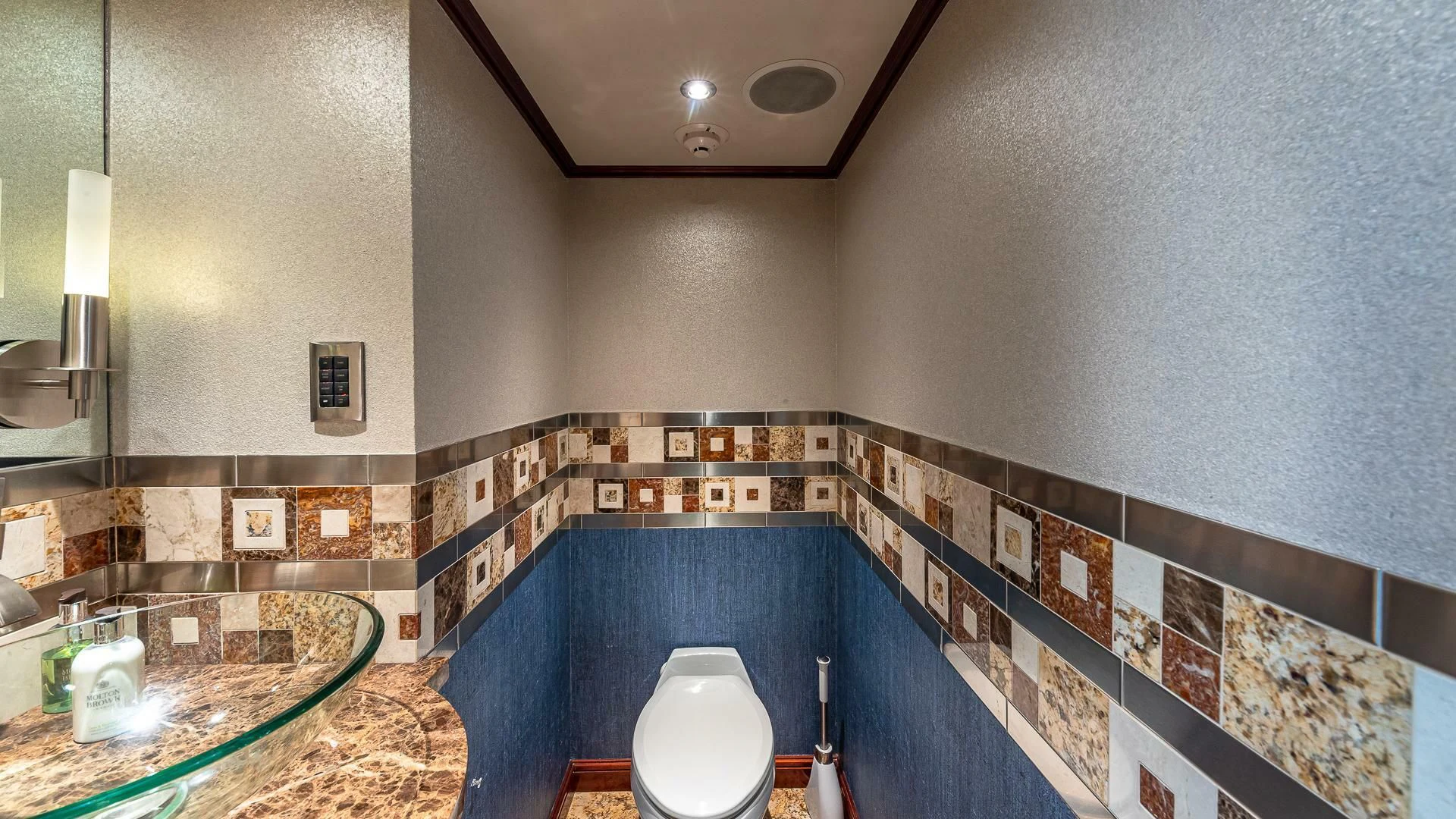 a bathroom with a toilet and a sink aboard KASHMIR Yacht for Charter