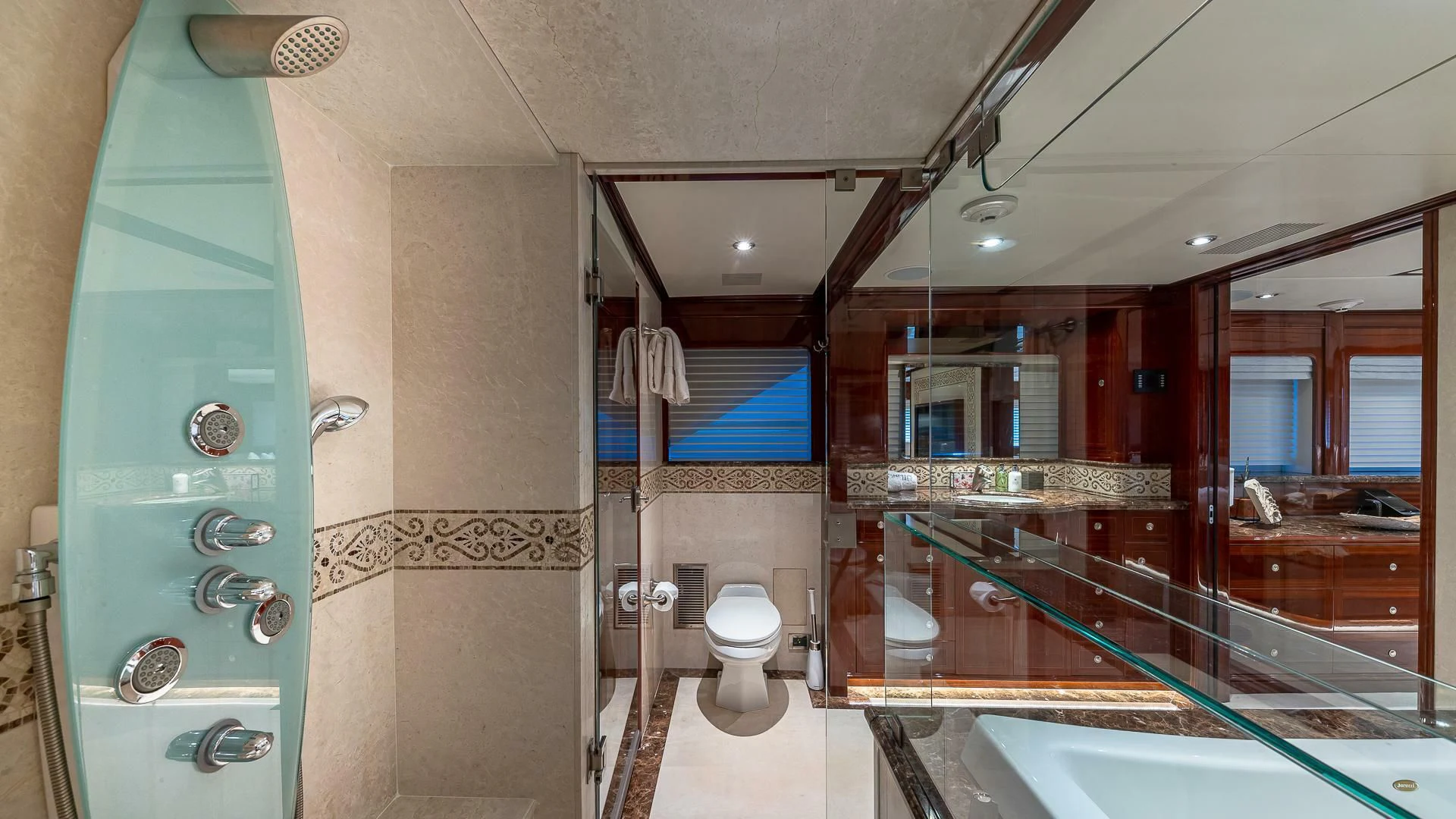 a bathroom with a glass shower aboard KASHMIR Yacht for Charter