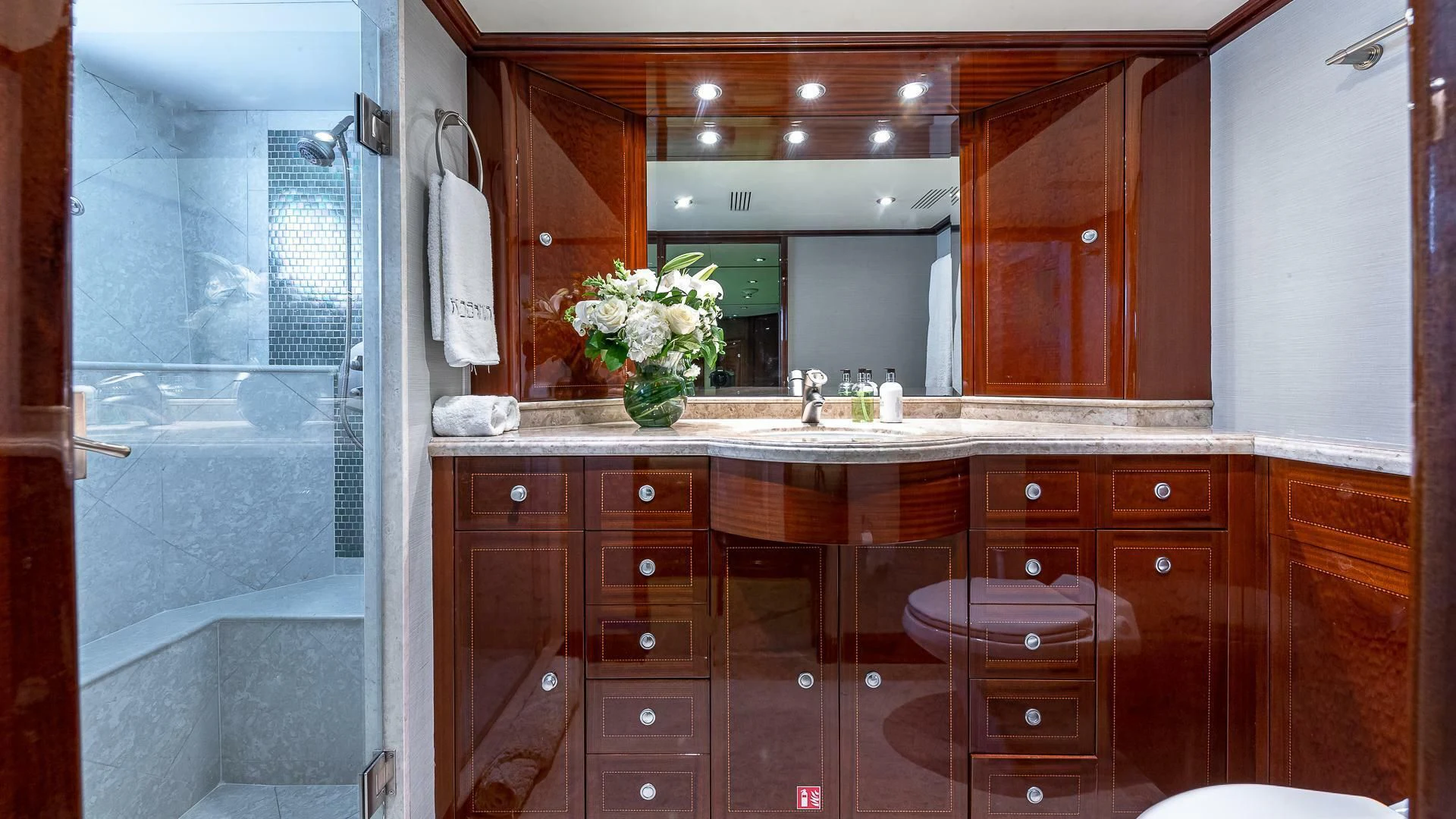 a bathroom with a large mirror aboard KASHMIR Yacht for Charter