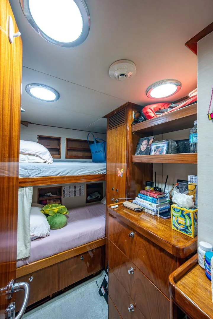 a small bedroom with a bunk bed aboard KASHMIR Yacht for Charter