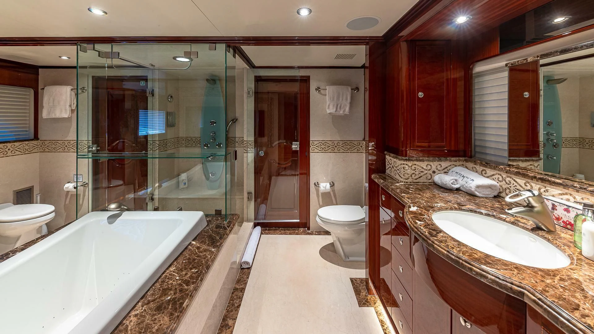 a bathroom with a large glass shower aboard KASHMIR Yacht for Charter