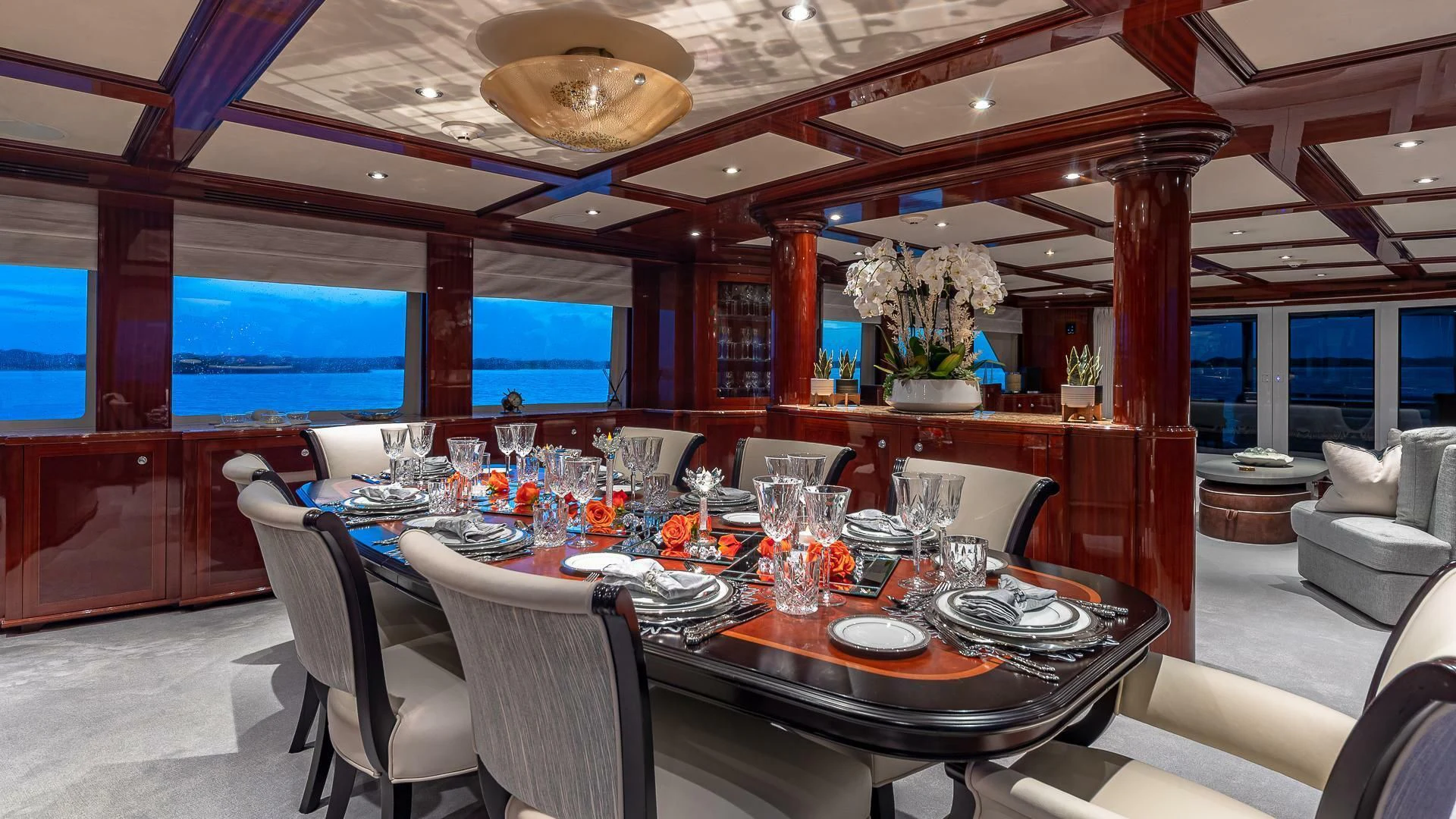 a dining room with a table set for a dinner aboard KASHMIR Yacht for Charter