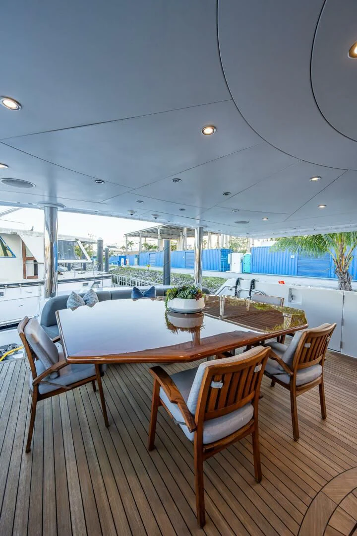 a table and chairs on a deck aboard KASHMIR Yacht for Charter