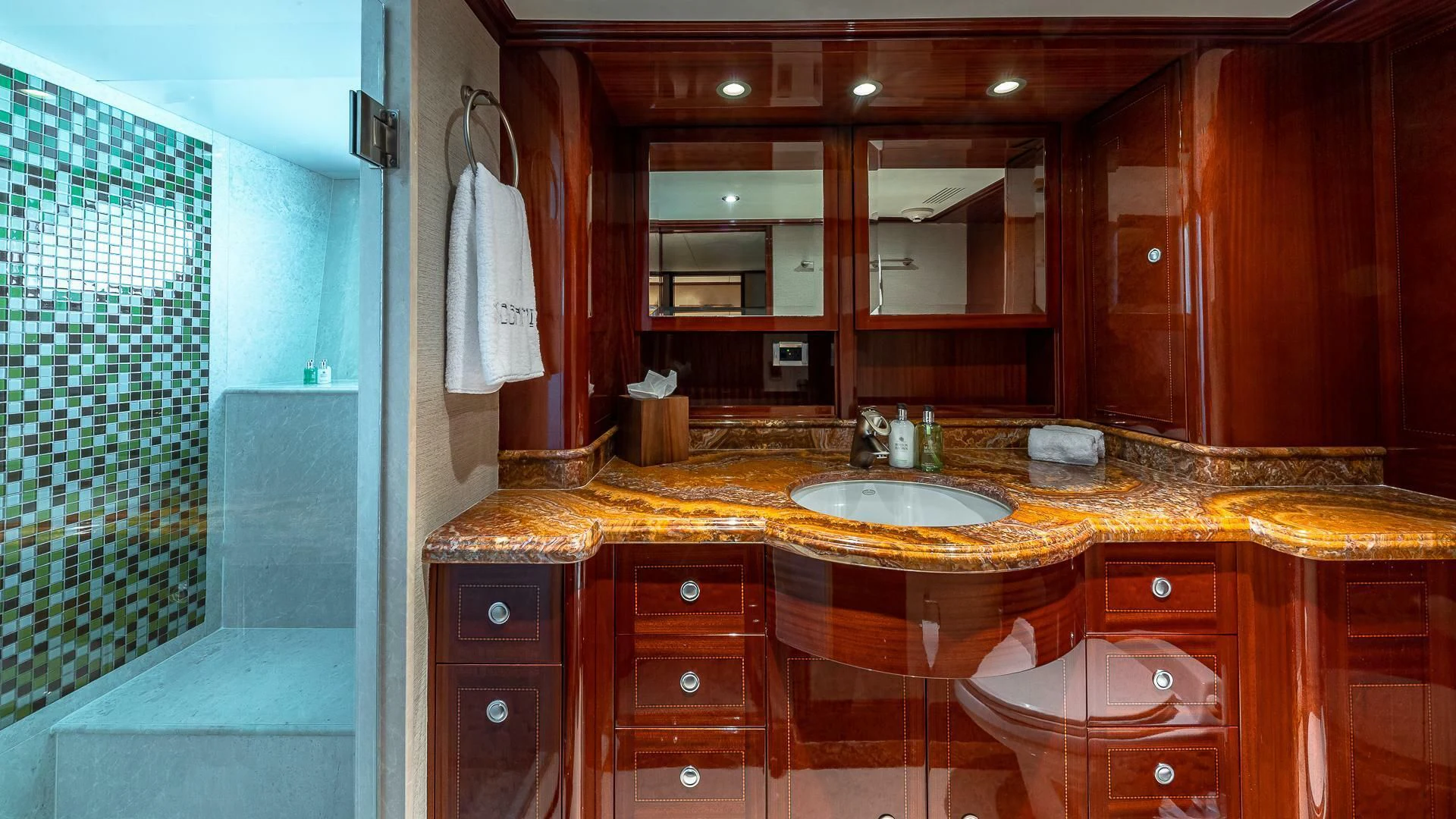 a bathroom with a sink and a mirror aboard KASHMIR Yacht for Charter
