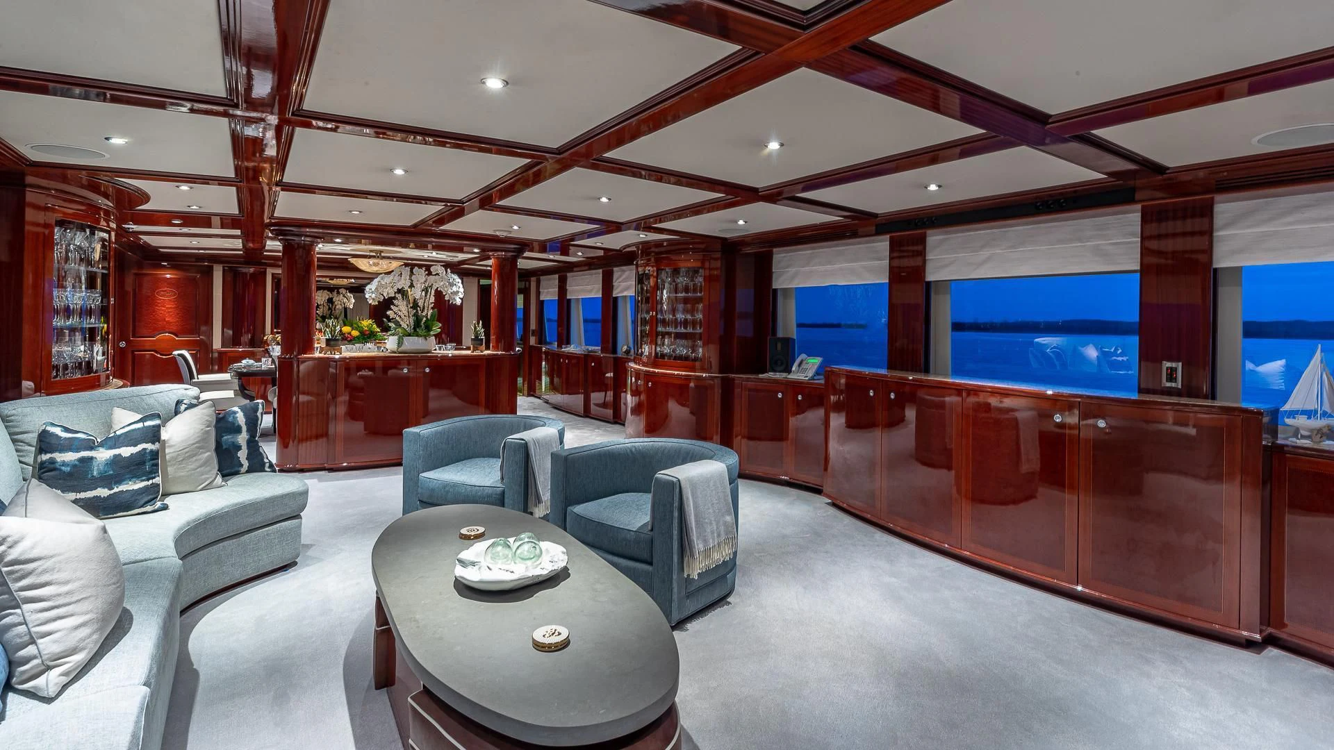a room with a table chairs and a couch aboard KASHMIR Yacht for Charter