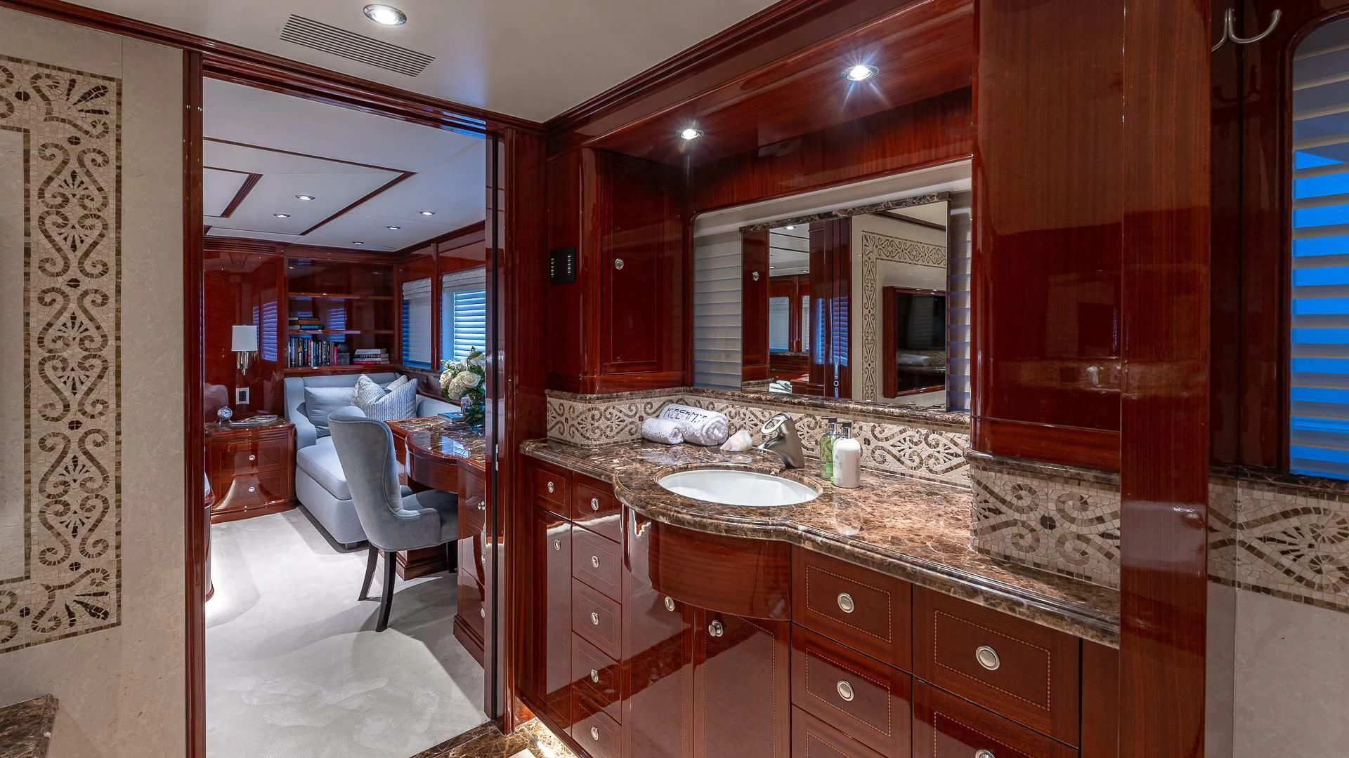 a bathroom with a sink and a mirror aboard KASHMIR Yacht for Charter