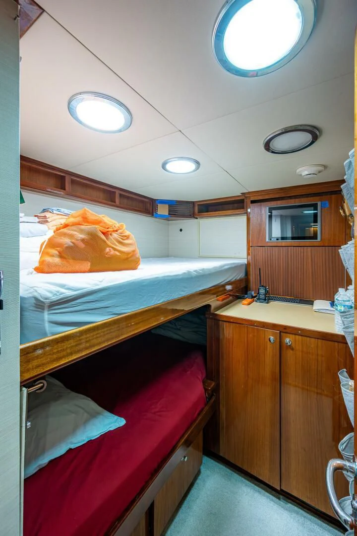 a bathroom with a bed and a sink aboard KASHMIR Yacht for Charter