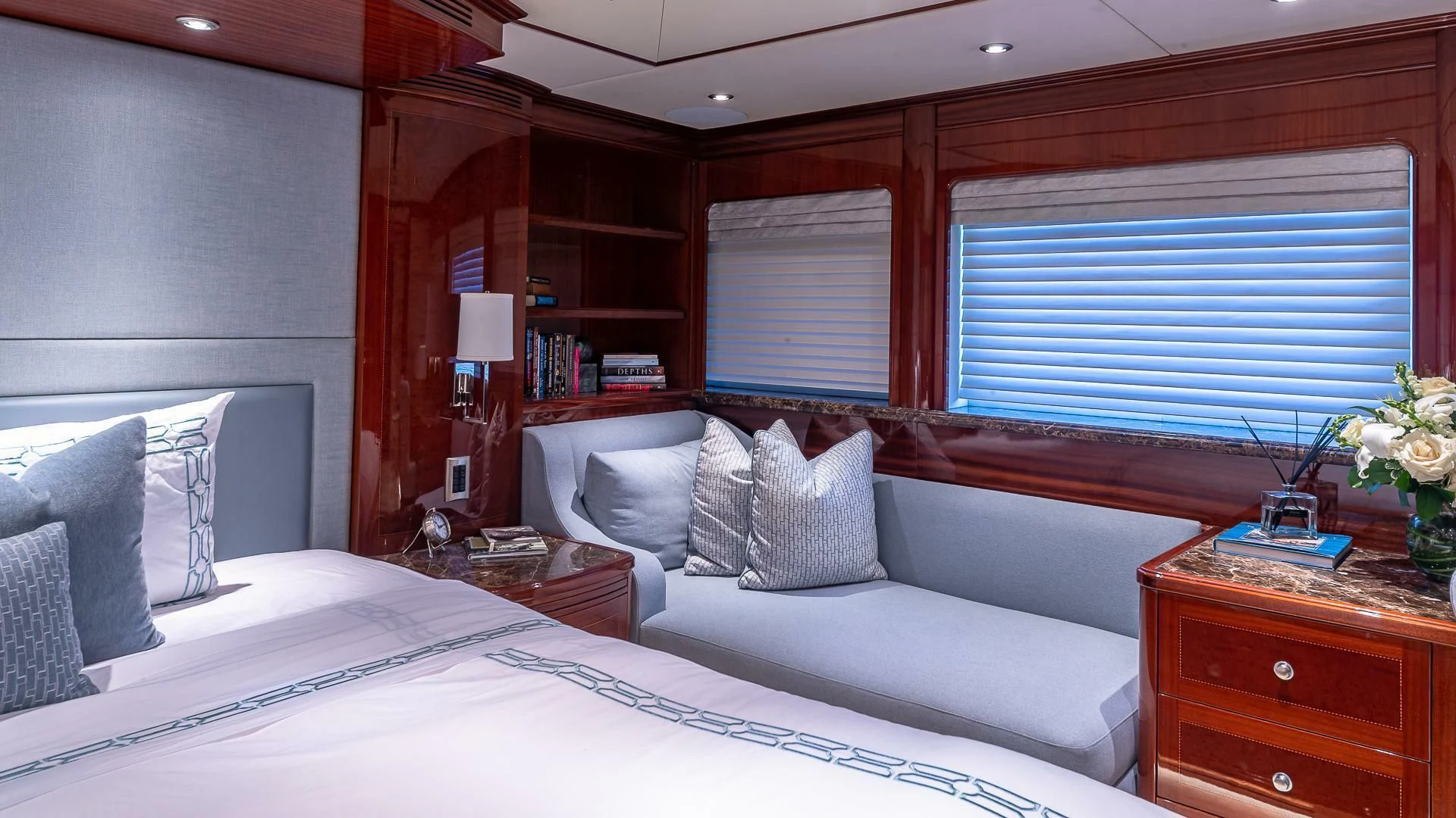 a room with a bed and a desk aboard KASHMIR Yacht for Charter