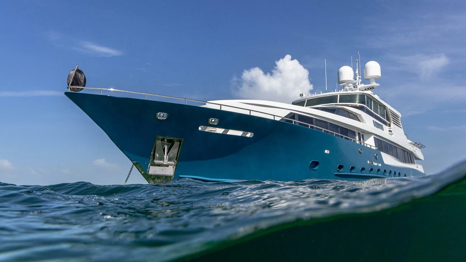 a large white boat in the ocean aboard KASHMIR Yacht for Charter