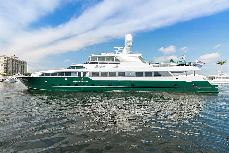 a large green boat in the water aboard KASHMIR Yacht for Charter
