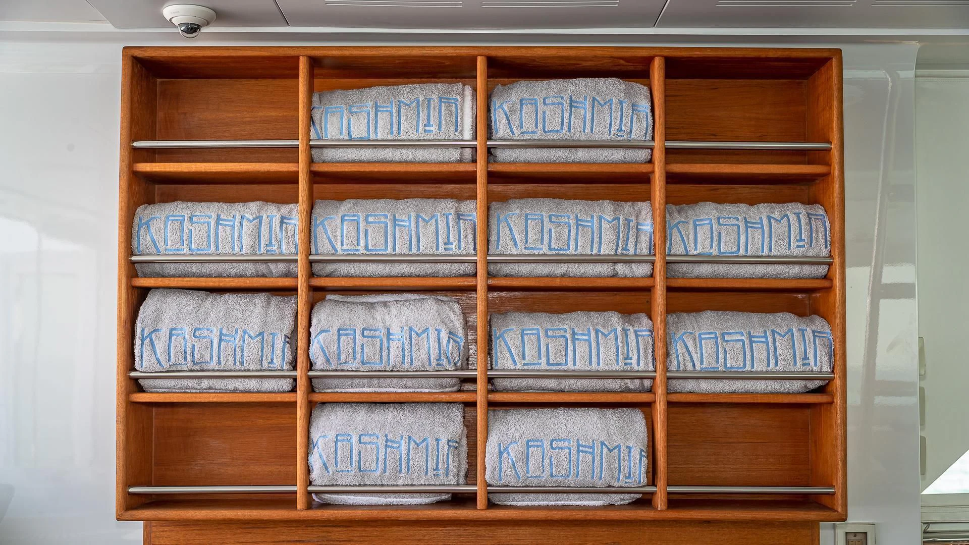a shelf with books on it aboard KASHMIR Yacht for Charter