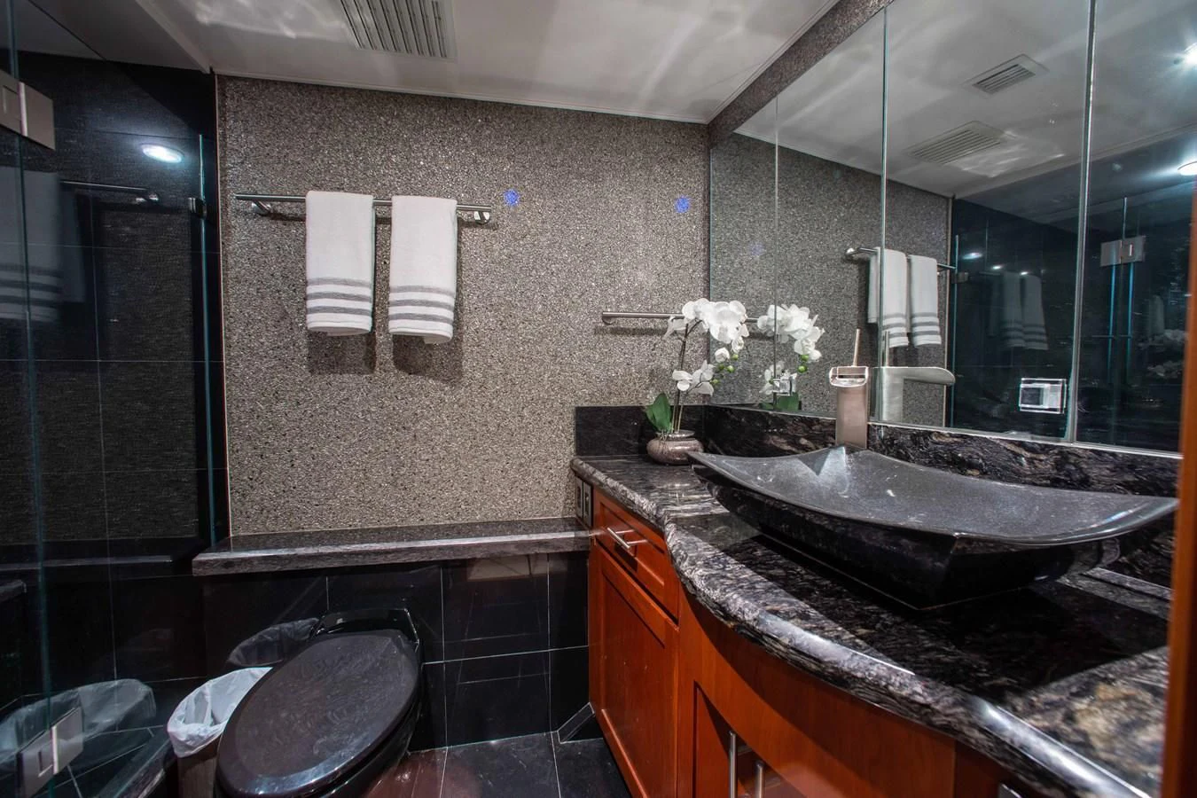 a bathroom with a large mirror aboard SEAQUEST Yacht for Sale
