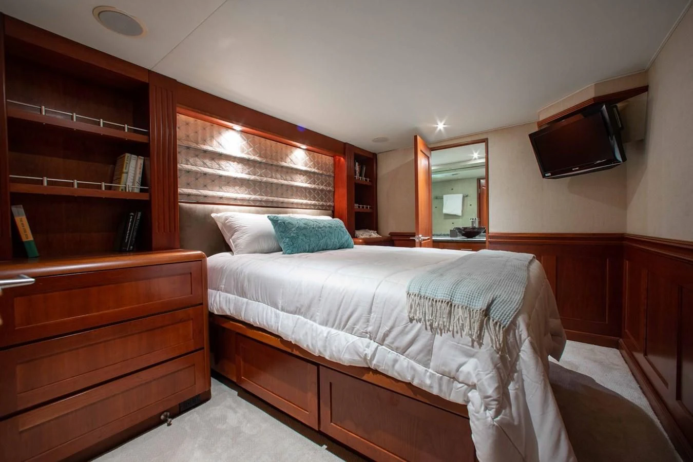 a bedroom with two beds aboard SEAQUEST Yacht for Sale