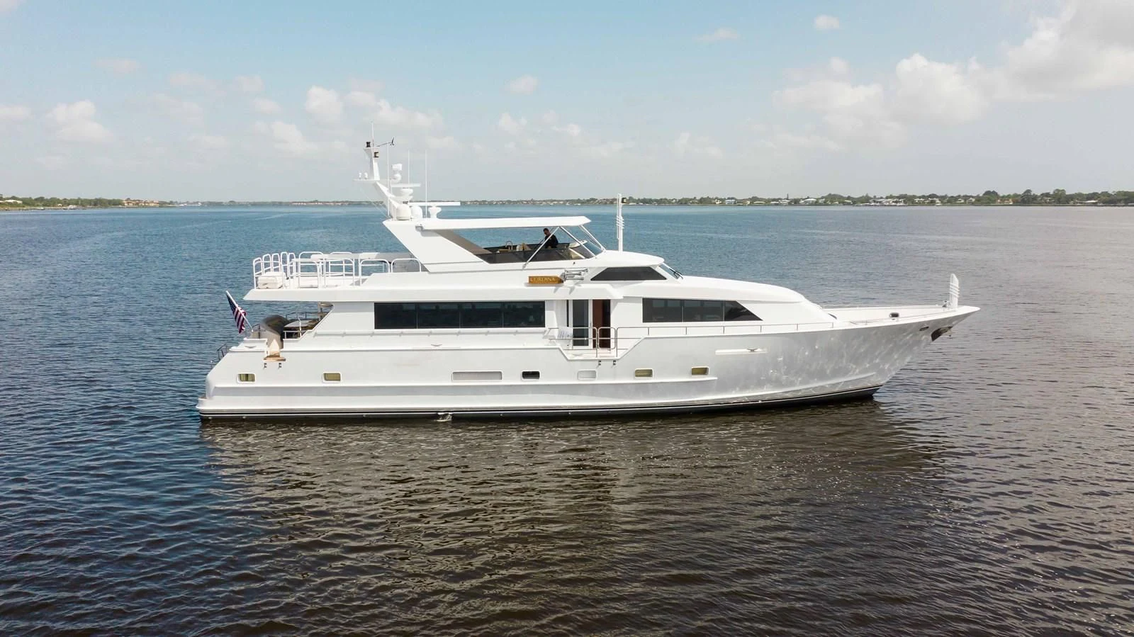 a white boat in the water aboard SEAQUEST Yacht for Sale