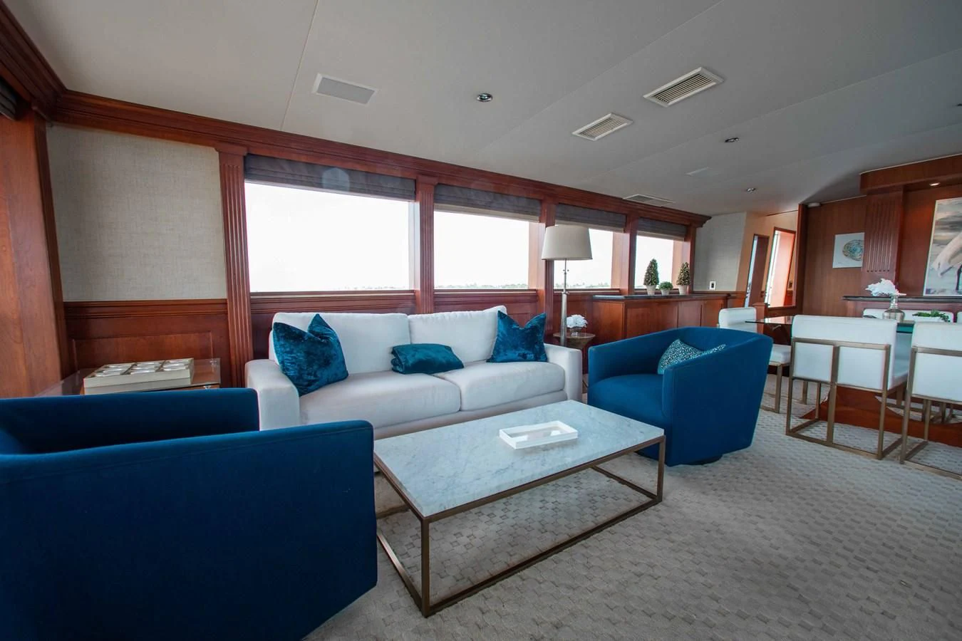 a living room with a couch and a table aboard SEAQUEST Yacht for Sale
