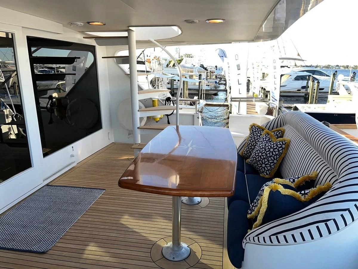 a room with a table and chairs aboard SEAQUEST Yacht for Sale