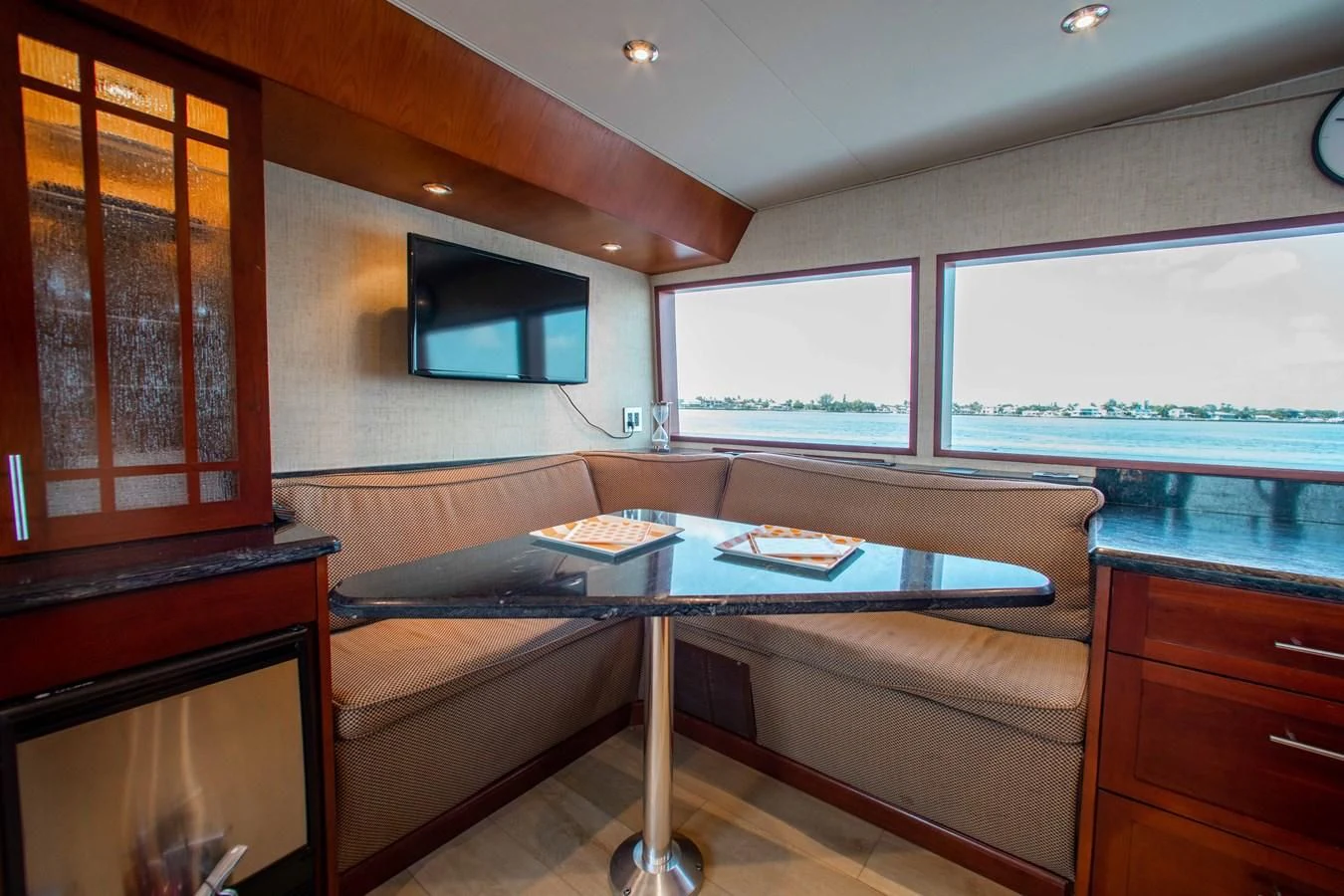 a living room with a couch and a television aboard SEAQUEST Yacht for Sale