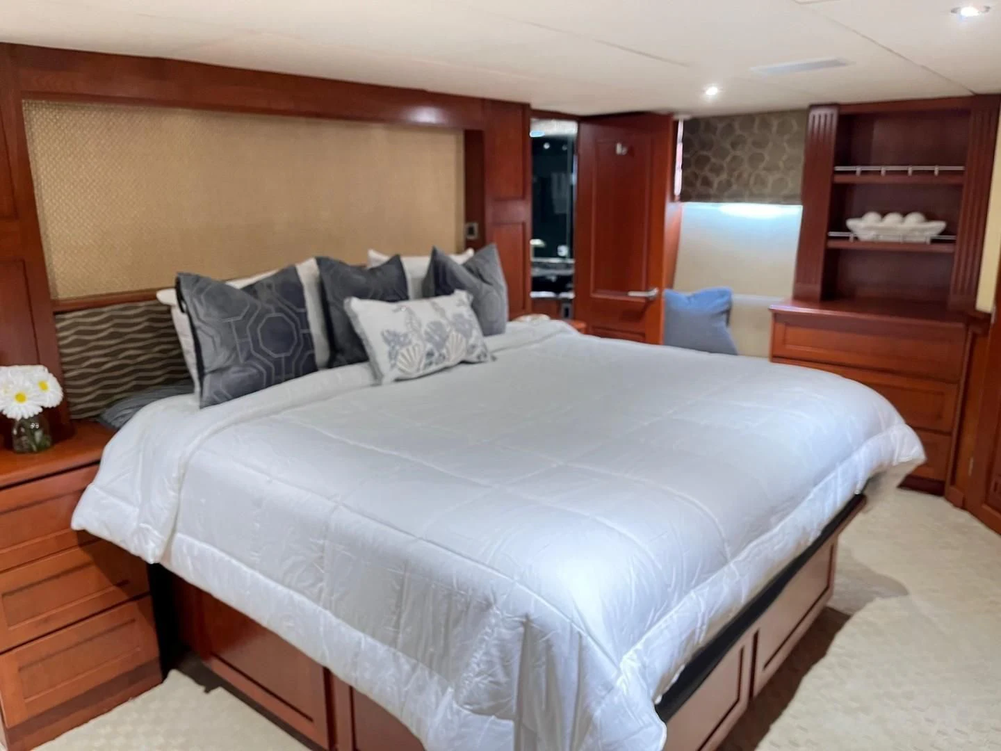 a bed with white sheets aboard SEAQUEST Yacht for Sale