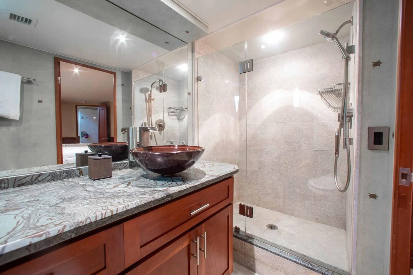 a bathroom with a sink and a large mirror aboard SEAQUEST Yacht for Sale
