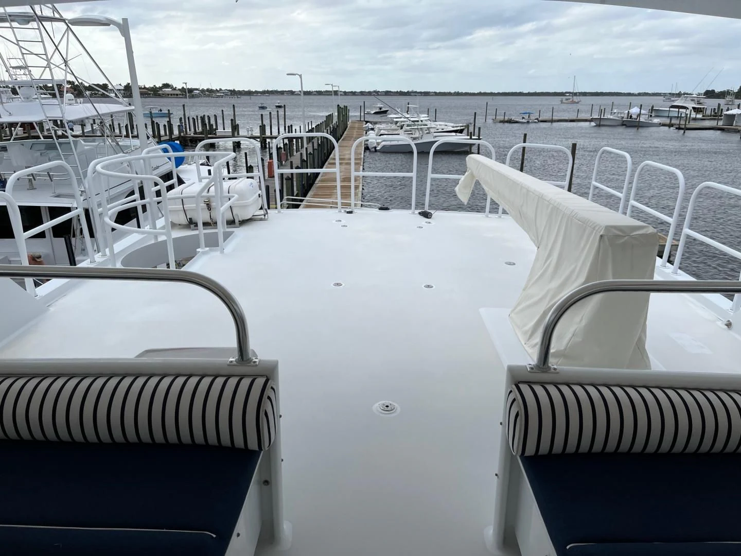 a deck with chairs and tables on it aboard SEAQUEST Yacht for Sale
