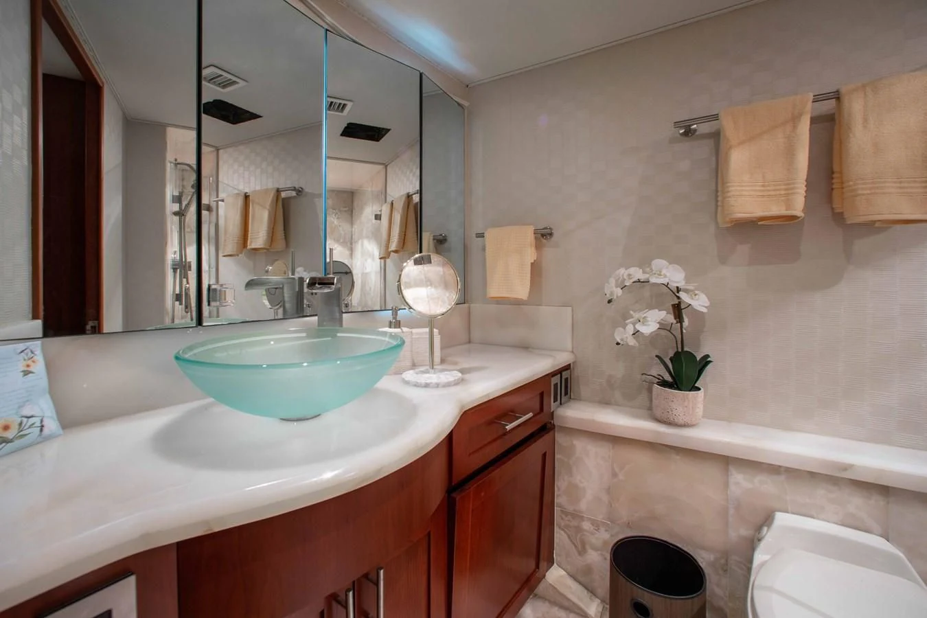 a bathroom with a sink and a mirror aboard SEAQUEST Yacht for Sale