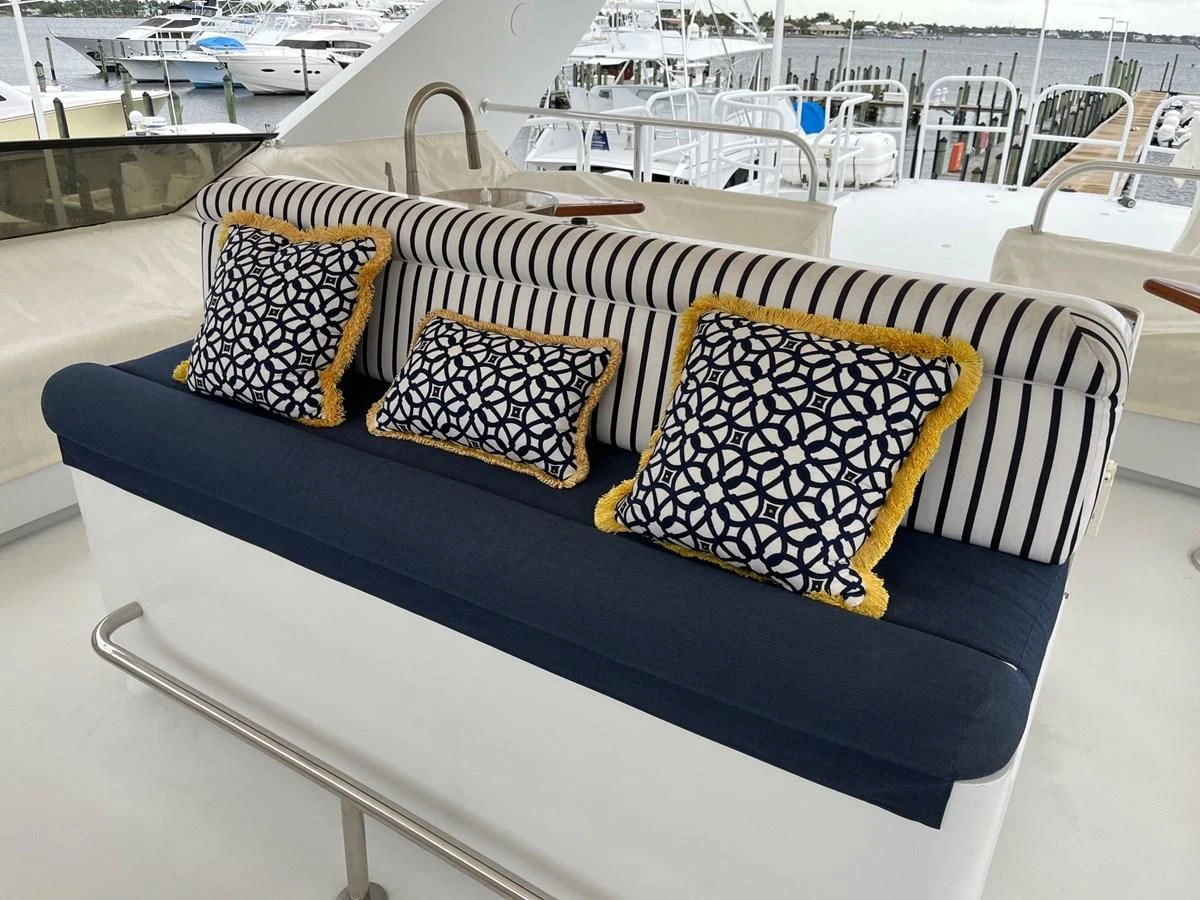 a colorful pillow on a boat aboard SEAQUEST Yacht for Sale
