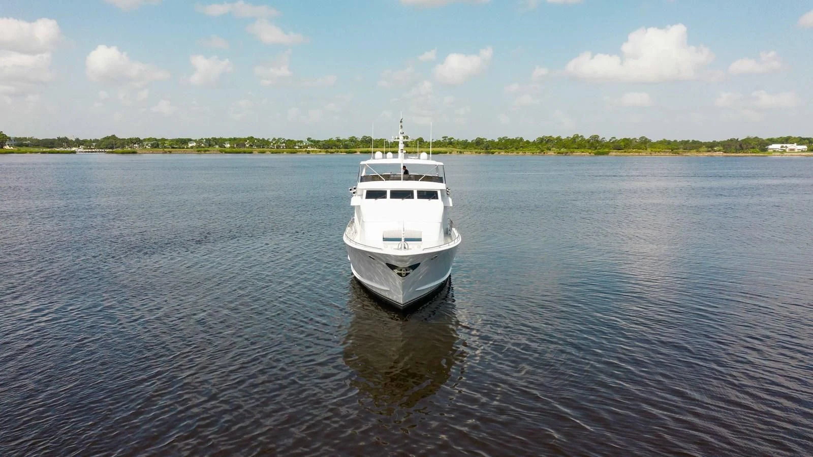 a white boat on the water aboard SEAQUEST Yacht for Sale
