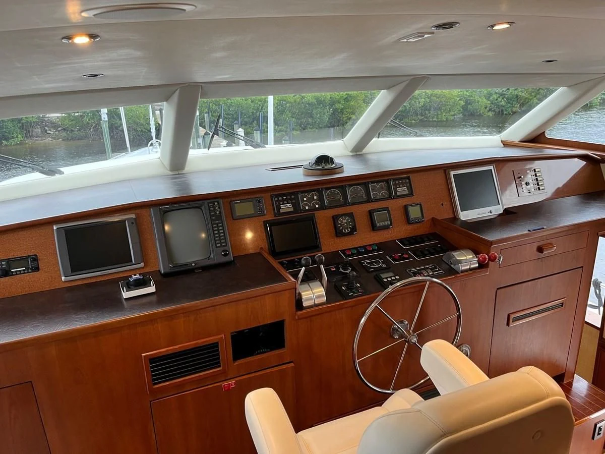 a room with a desk and a television aboard SEAQUEST Yacht for Sale