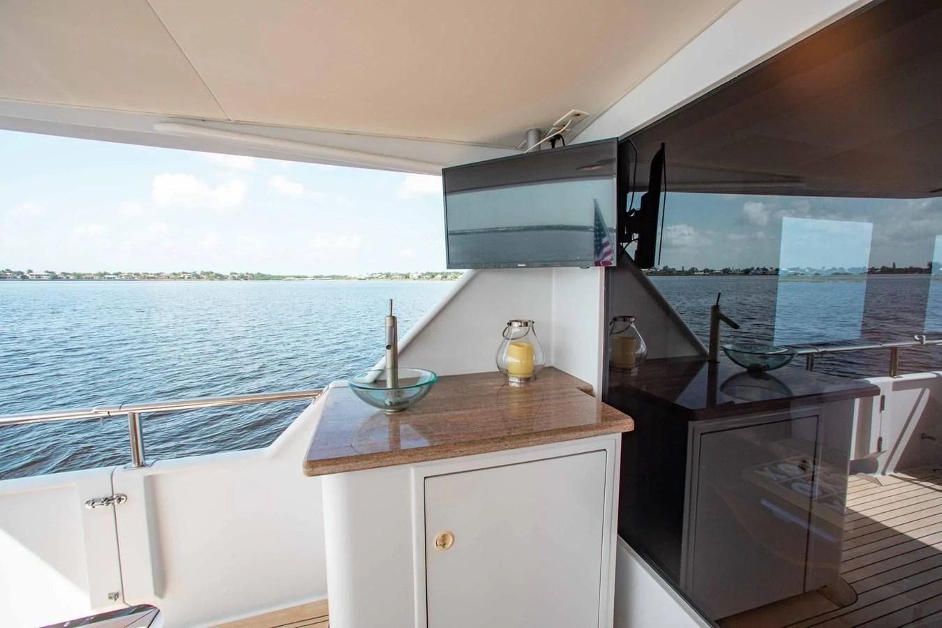 a kitchen with a sink and cabinets aboard SEAQUEST Yacht for Sale