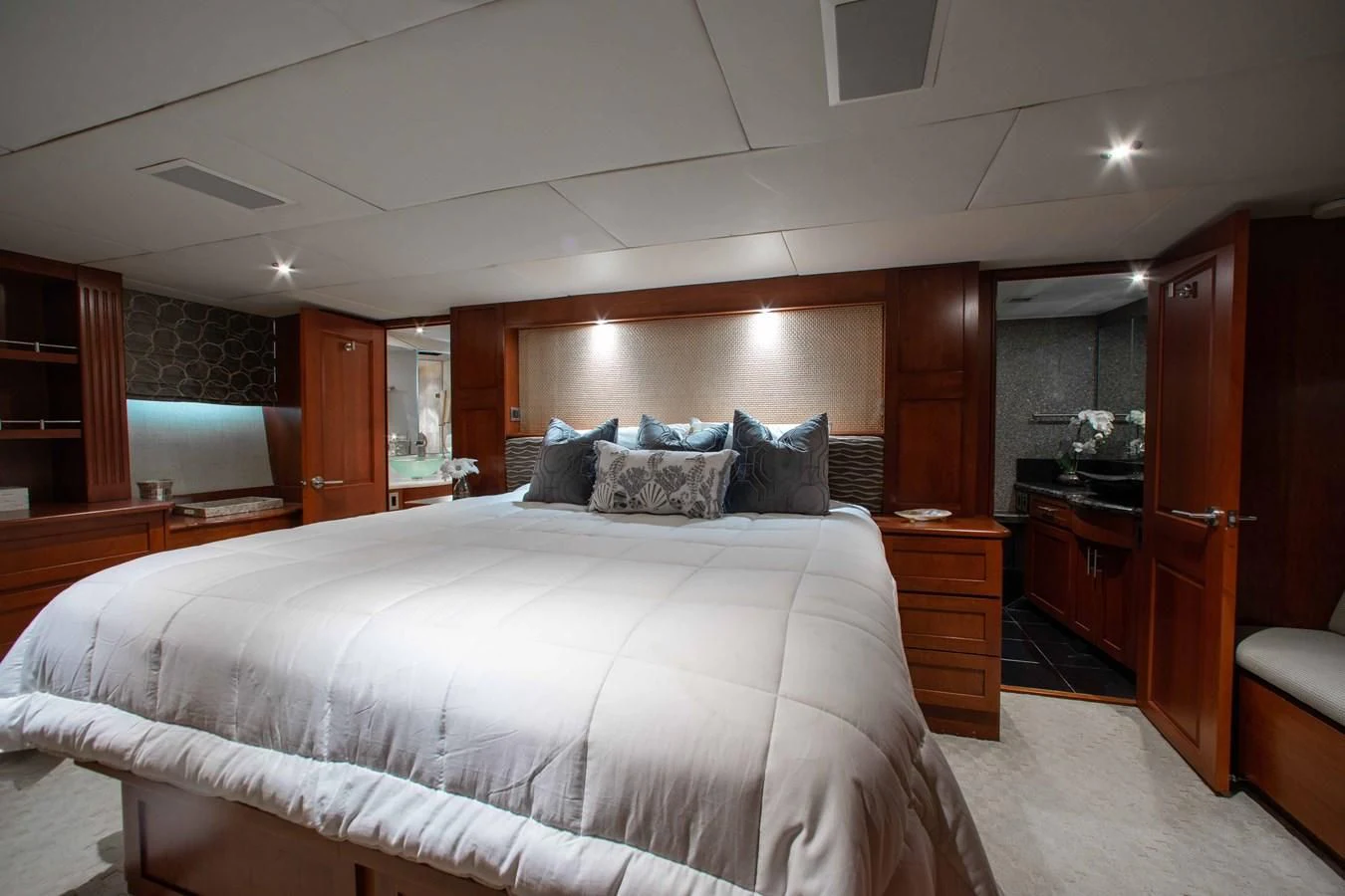 a large bedroom with a large bed aboard SEAQUEST Yacht for Sale