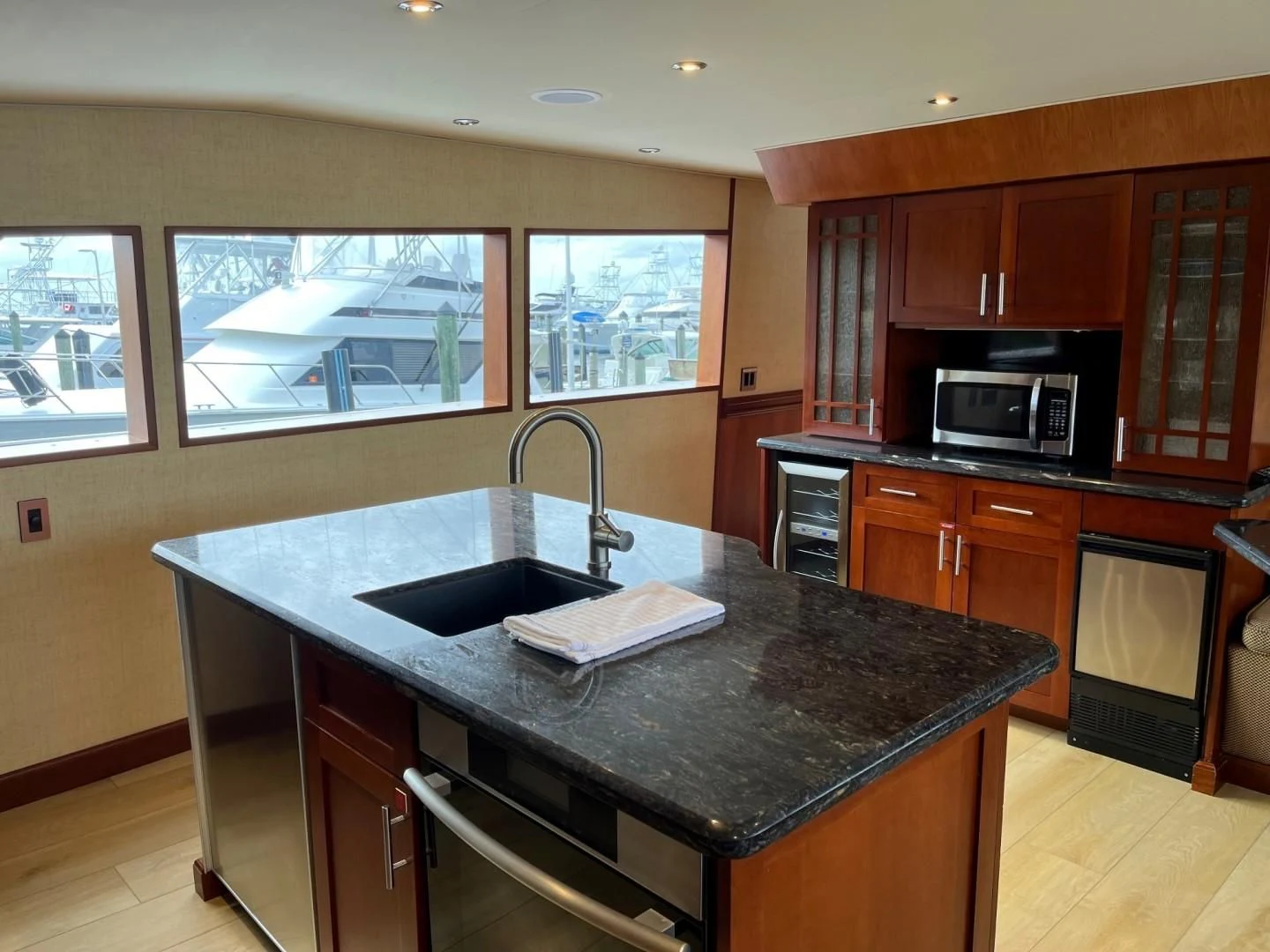 a kitchen with a black counter top aboard SEAQUEST Yacht for Sale