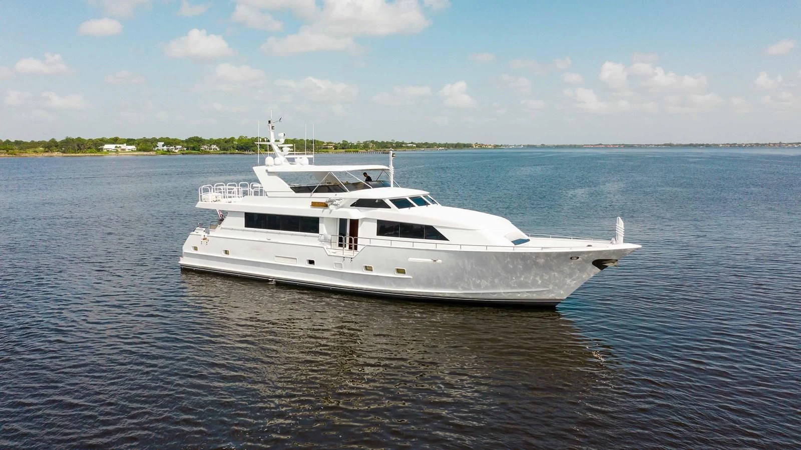 a white boat in the water aboard SEAQUEST Yacht for Sale
