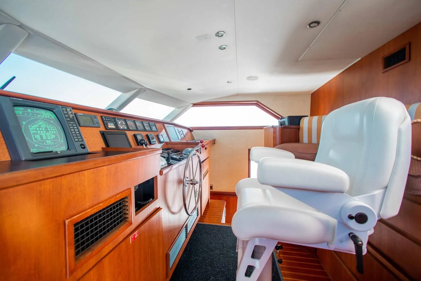 a room with a television and a chair aboard SEAQUEST Yacht for Sale
