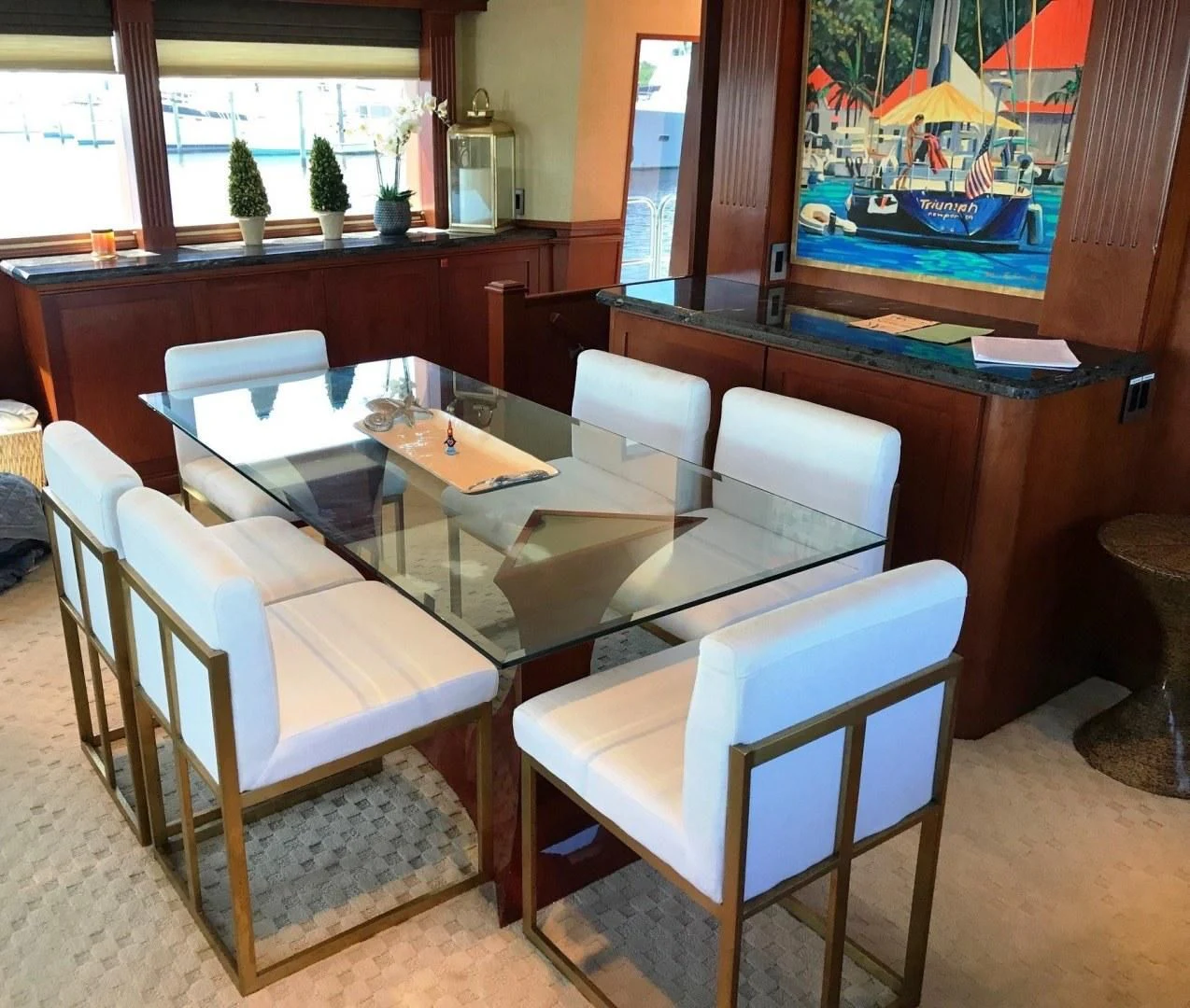 a table with chairs and a bench aboard SEAQUEST Yacht for Sale