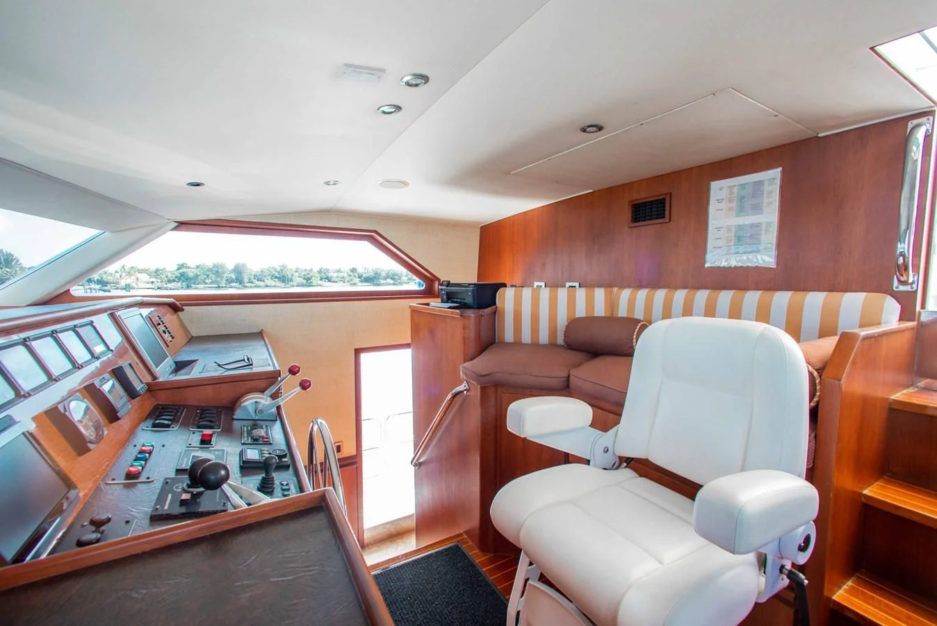 a living room with a table and chairs aboard SEAQUEST Yacht for Sale