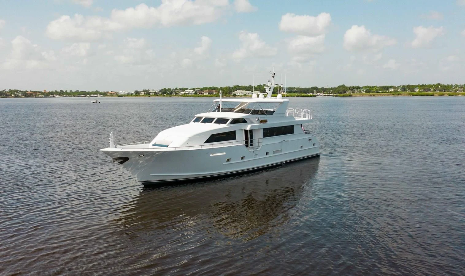 a white boat on the water aboard SEAQUEST Yacht for Sale