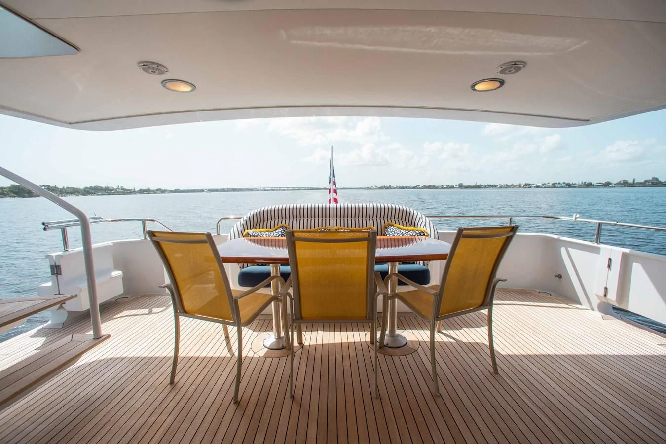 a table and chairs on a deck aboard SEAQUEST Yacht for Sale