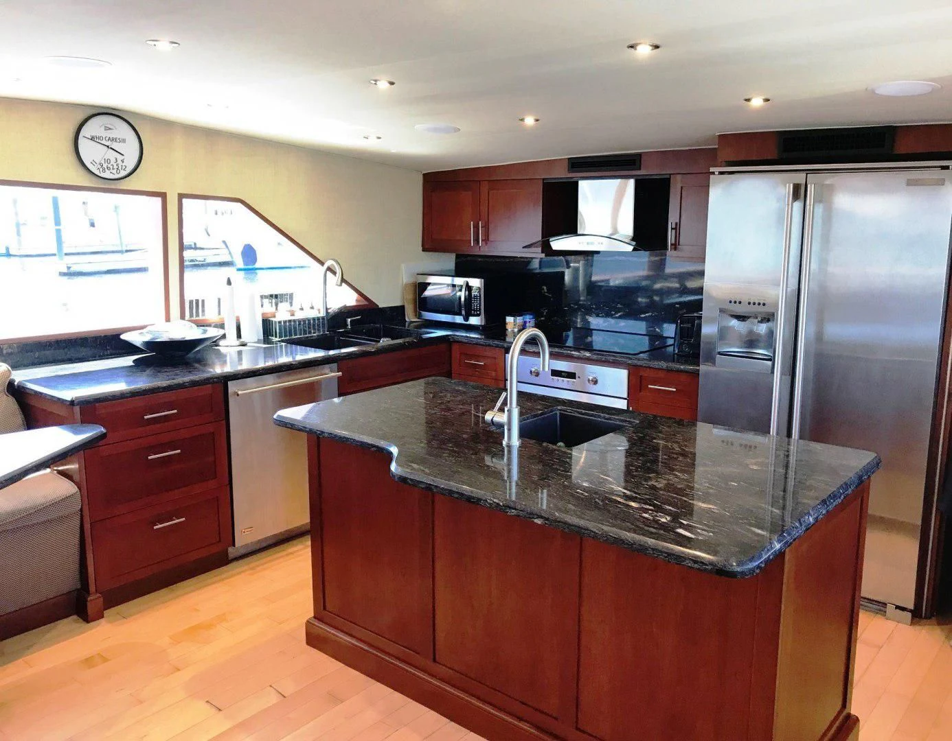 a kitchen with a stainless steel refrigerator aboard SEAQUEST Yacht for Sale