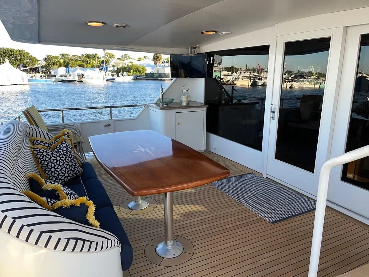 a table and chairs in a room aboard SEAQUEST Yacht for Sale