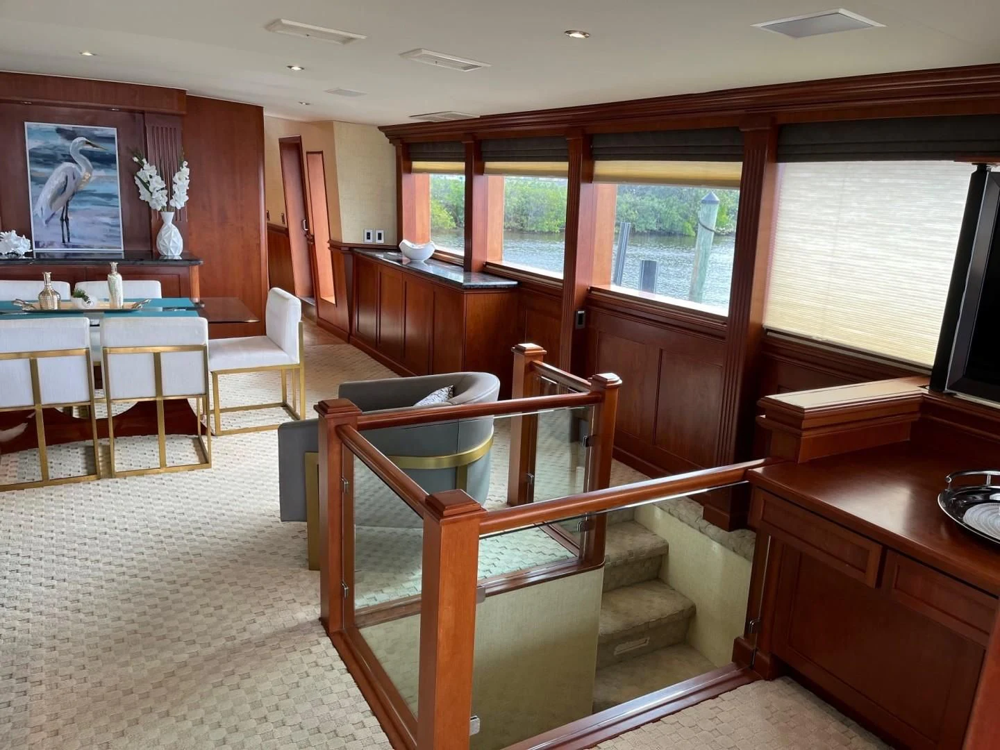 a room with a bench and a table and chairs aboard SEAQUEST Yacht for Sale