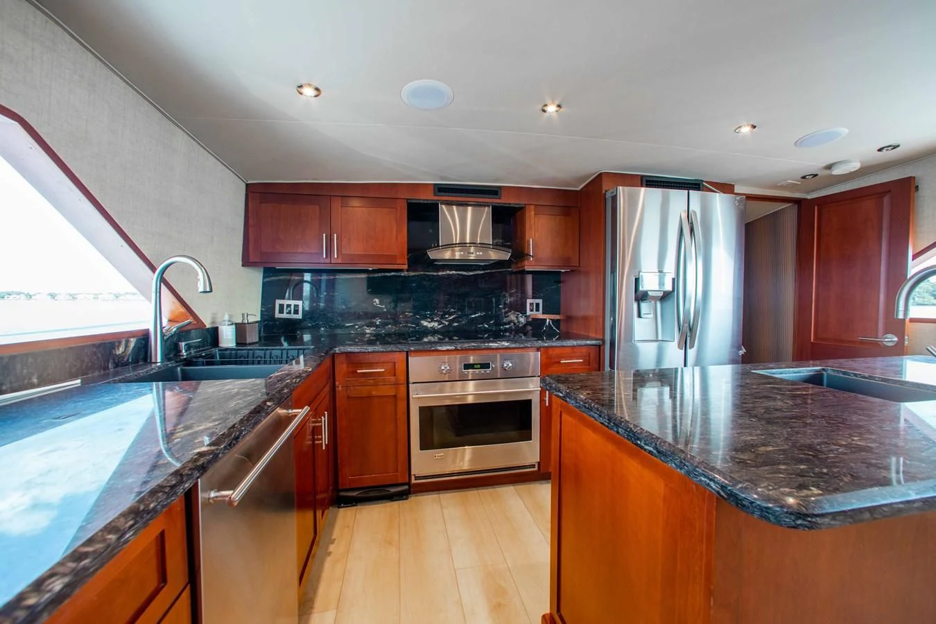 a kitchen with a stove and oven aboard SEAQUEST Yacht for Sale
