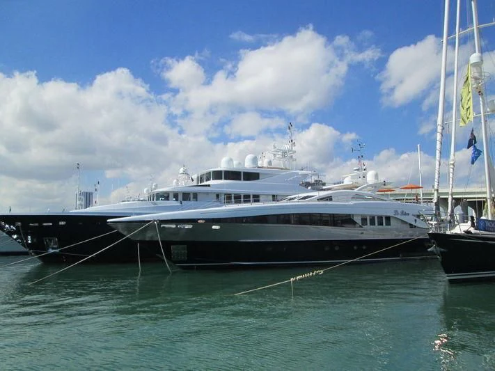a boat docked at a pier aboard HASHTAG Yacht for Sale