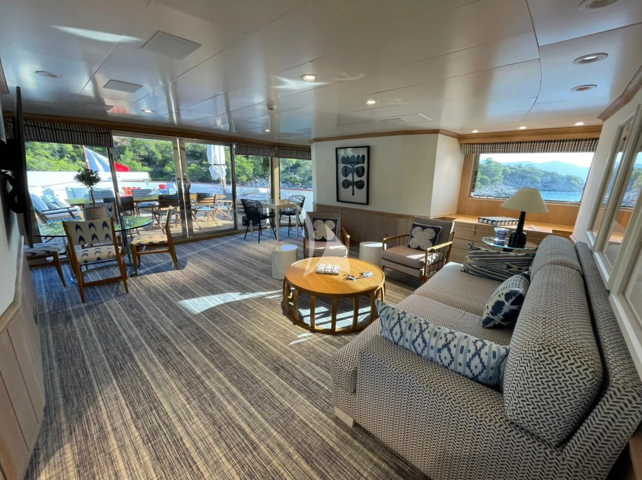 a living room with a large glass window aboard NATALIA V Yacht for Sale