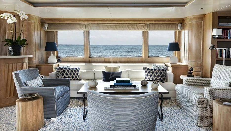 a living room with a large window aboard NATALIA V Yacht for Sale